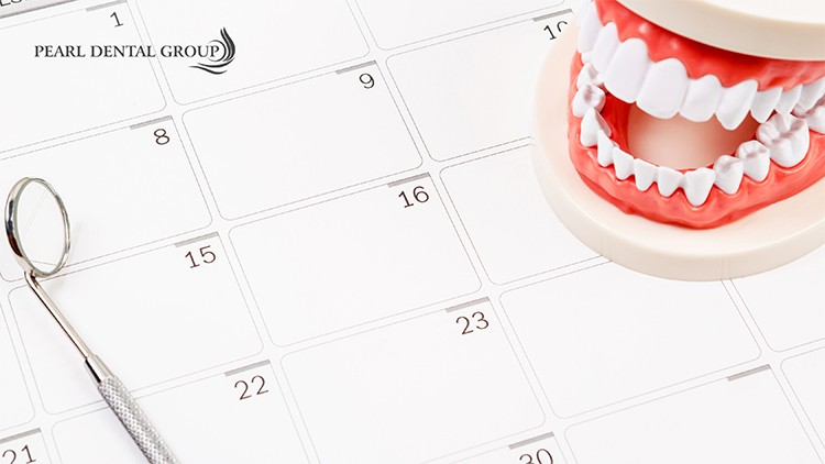 a calendar alongside dentists instruments