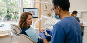 A dentist explains emergency root canal to his patient